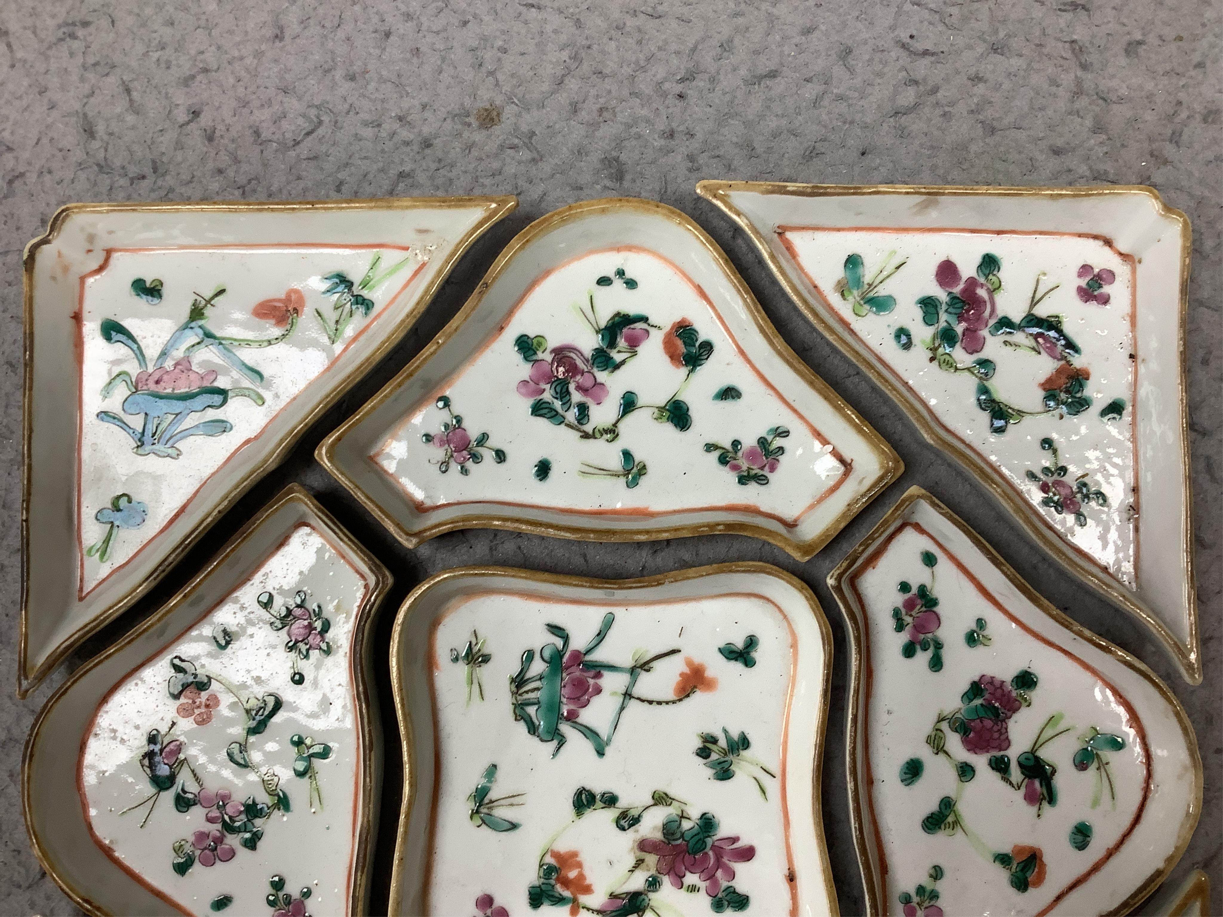 A square Chinese hardwood tray of famille rose geometric dishes, 30cm. Condition - fair to good